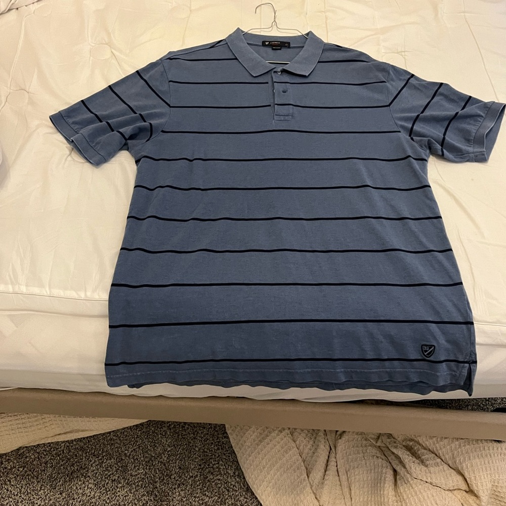 Blue striped polo.